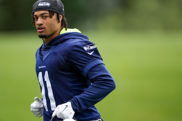 Seahawks open training camp with attention on defense s potential